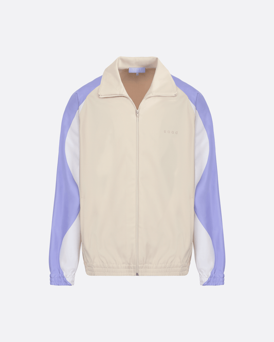 Veste zippée beige avec empiècements blanc et bleu sur les manches logo saad ton sur ton côté coeur
